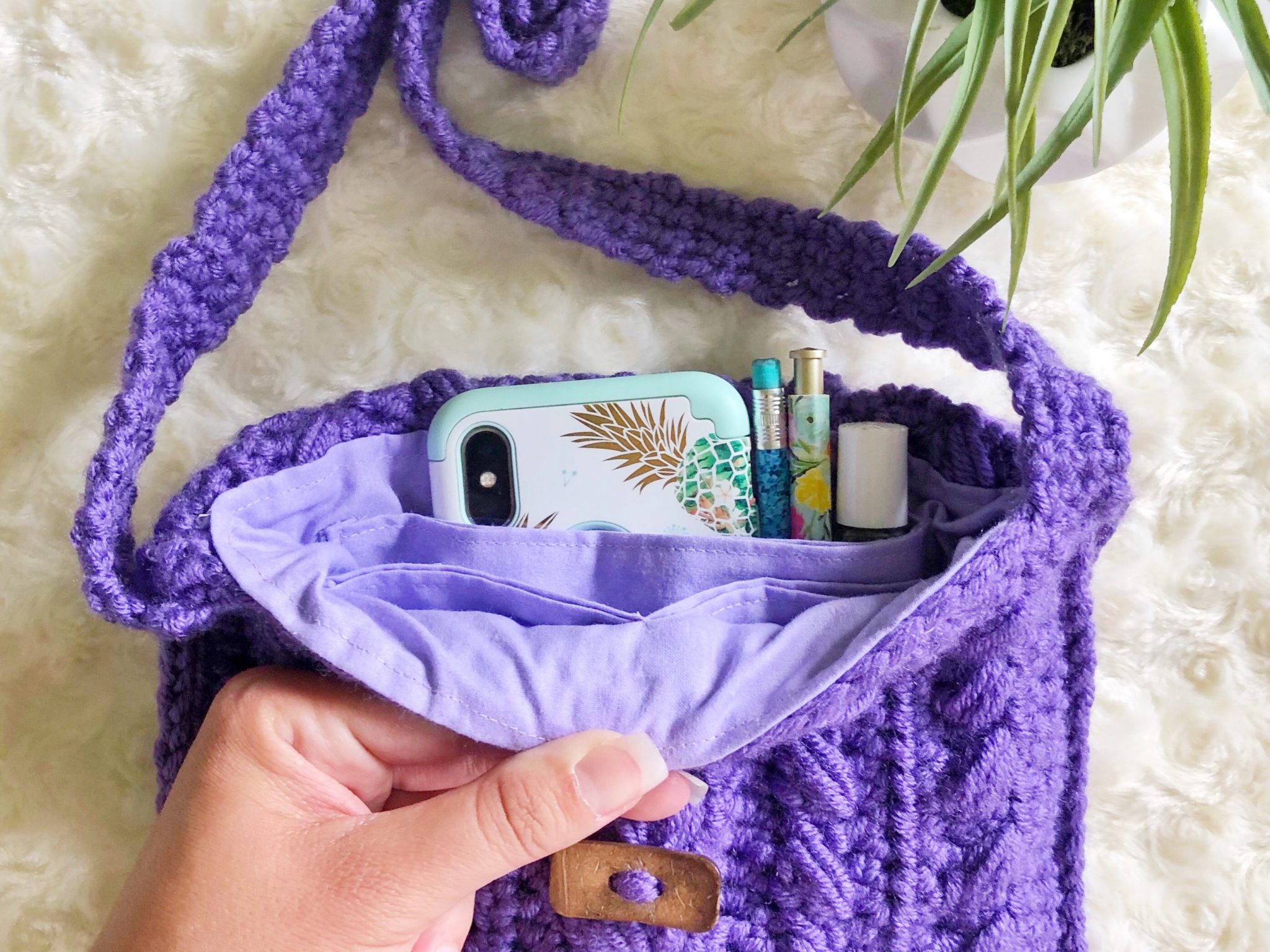 Purple crochet purse with fabric lining